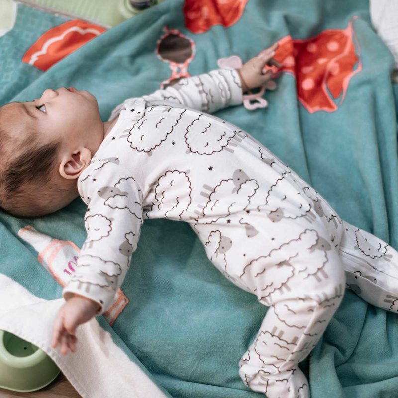 how to help baby roll over