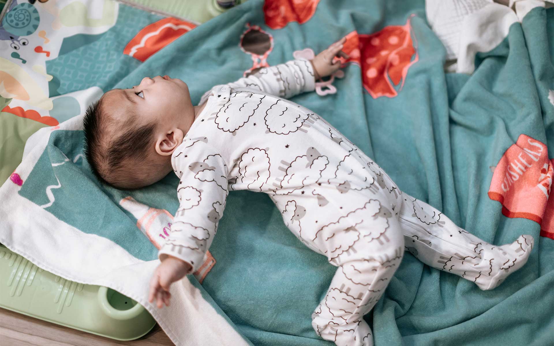 How To Help Your Baby Roll Over Using Purposeful Play