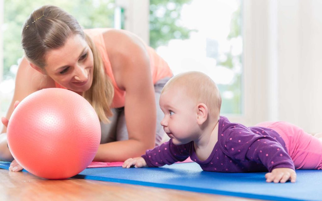 How To Help Your Baby Roll Over Using Purposeful Play