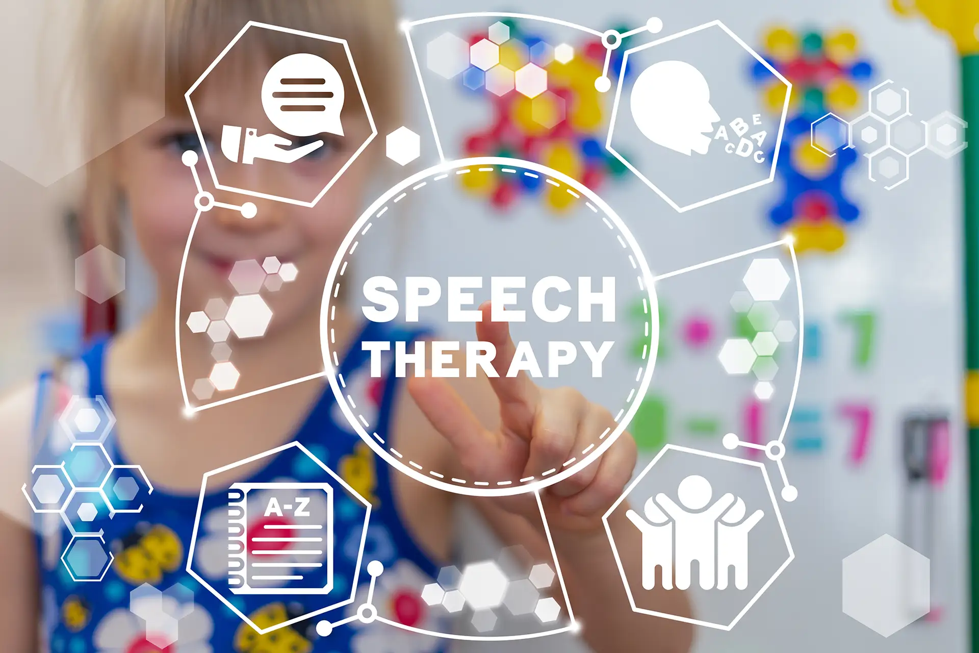 A young girl reaching out to touch a 3D illustration with icons to represent the concept of speech therapy